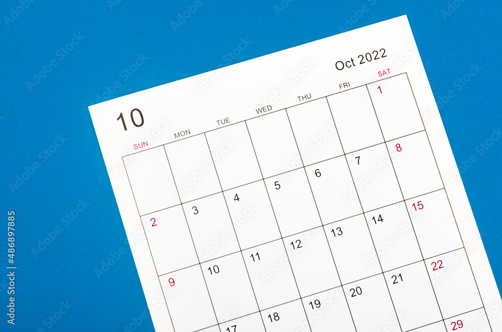 October 2022 calendar sheet on blue background.