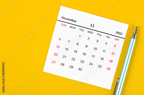 November 2022 calendar on yellow background.