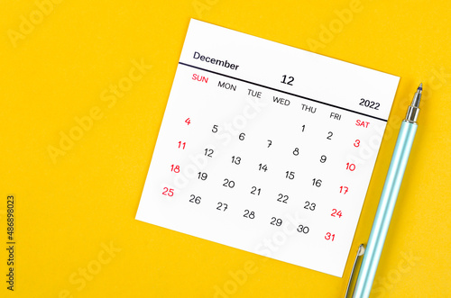 December 2022 calendar on yellow background.
