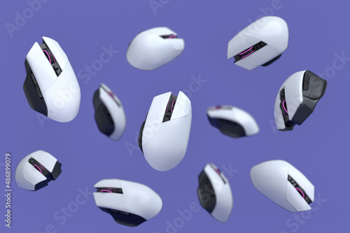 Flying gamer mouse on purple background with blur