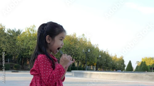 Slow motion scene ofAsian girls eating seaweed snacks
