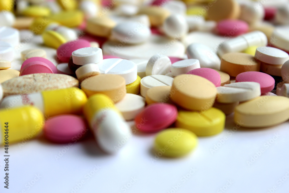 Different pills on color background, flat lay. Different pills on color background, flat lay.