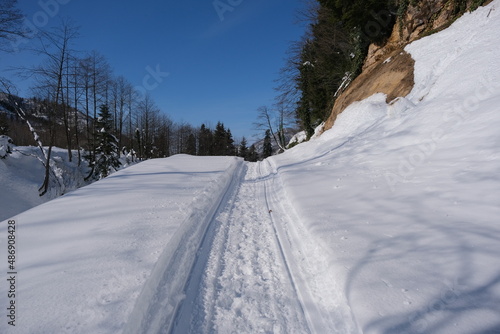 Snow covered road. Road and vehicle tracks on snow. top of mountain at winter Borçka Turkey.