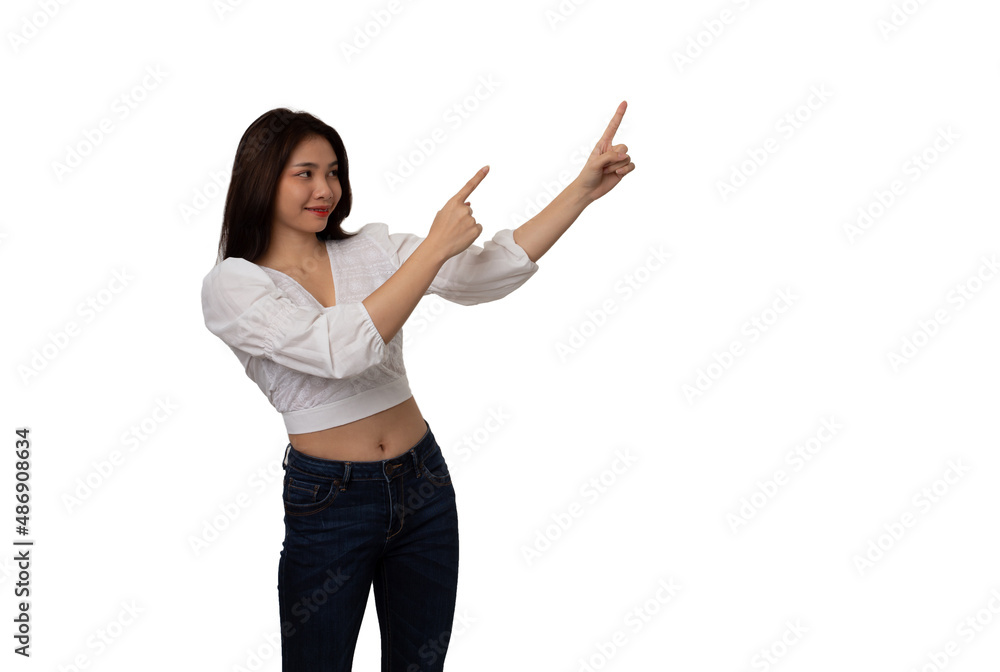 Happy Asian woman smiling with thumbs up pointing at empty space on white background Happy Asian woman smiling with thumbs up pointing at empty space on white background