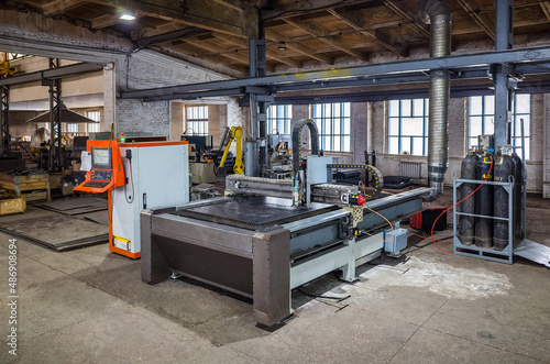 CNC laser cutting machine for sheet metal in the production area. The picture was taken in Russia, in the workshop of a mechanical plant