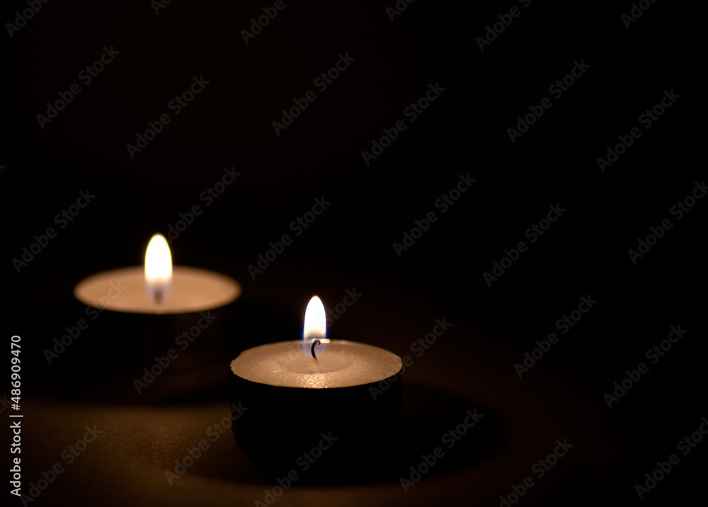 Burning candles flame on dark surface. Burning candles flame on dark surface.