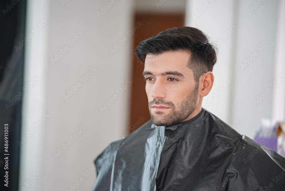 Professional actor preparation before shoot. Handsome young man applying by professional make up of visagist. Male makeup Professional actor preparation before shoot. Handsome young man applying by professional make up of visagist. Male makeup
