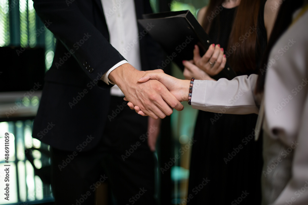 Closeup on business people hand shaking Closeup on business people hand shaking