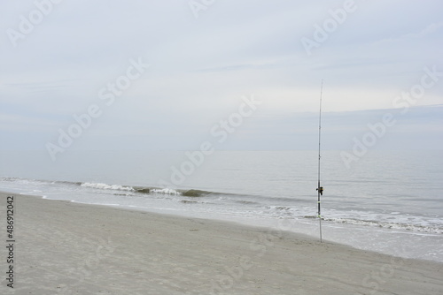 Surf casting - beach fishing pole - Hilton Head Island South Carolina © Mike