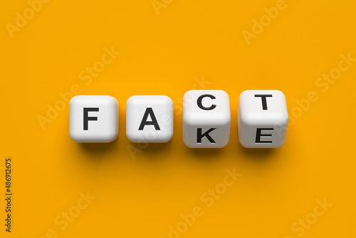 Fact or fake. White blocks on a yellow background. Conceptual 3d illustration.