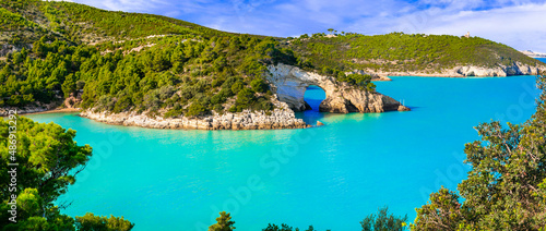 Italian holidays in Puglia - National park Gargano with beautiful turquoise sea and natural arch near Vieste town. Itay travel and nature landscape