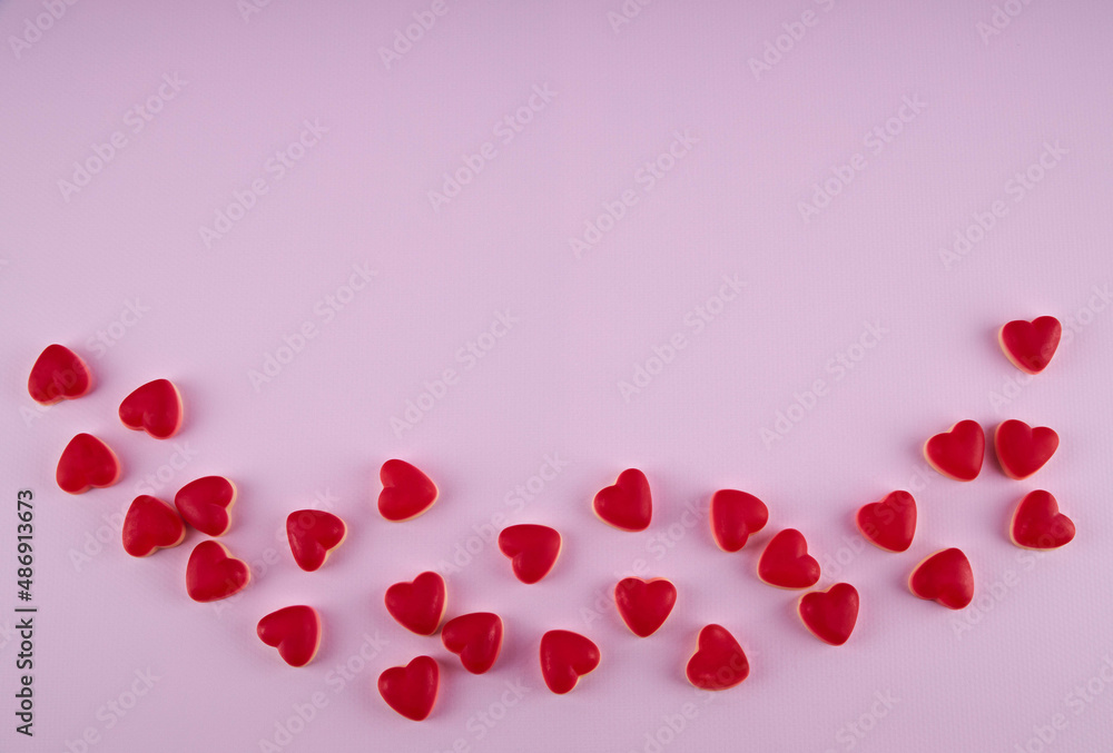 jelly hearts on a pink background, top viev, copy spase