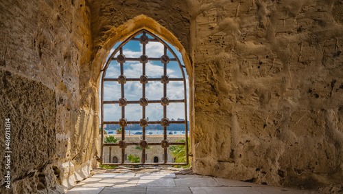 Photo The window opening in the ancient Citadel of Qaitbay is barred