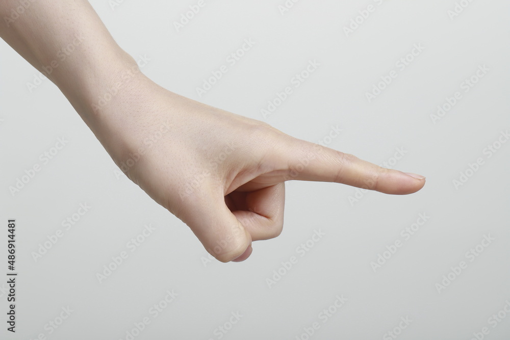 Close-Up Of Cropped Hand Pointing Finger Close-Up Of Cropped Hand Pointing Finger