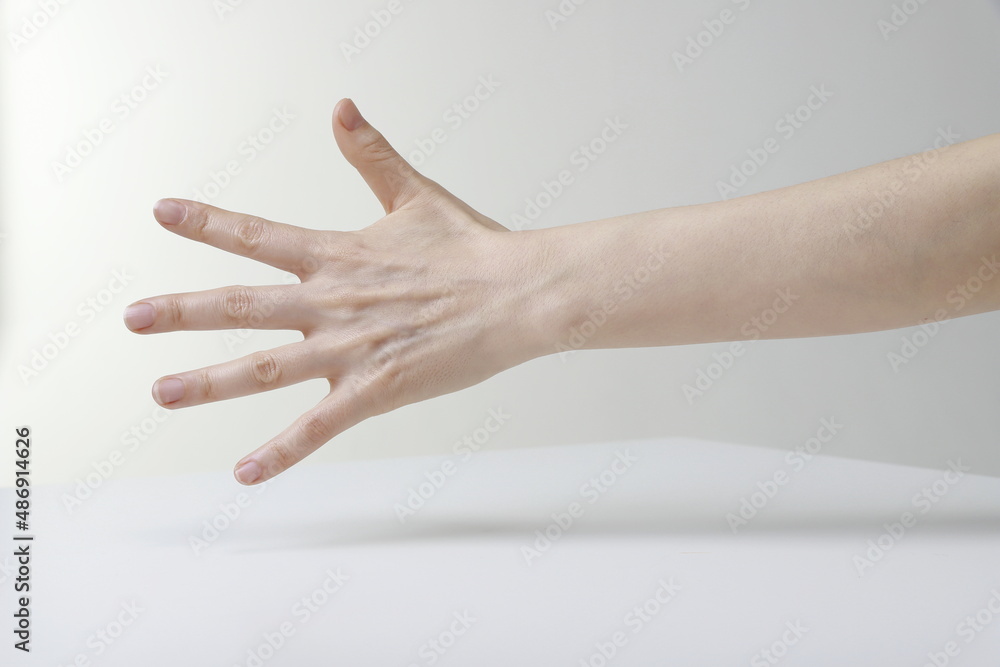 Cropped Hand Of Woman Reaching Out Cropped Hand Of Woman Reaching Out