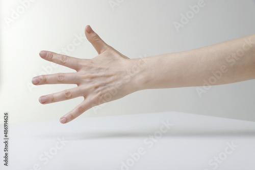 Cropped Hand Of Woman Reaching Out