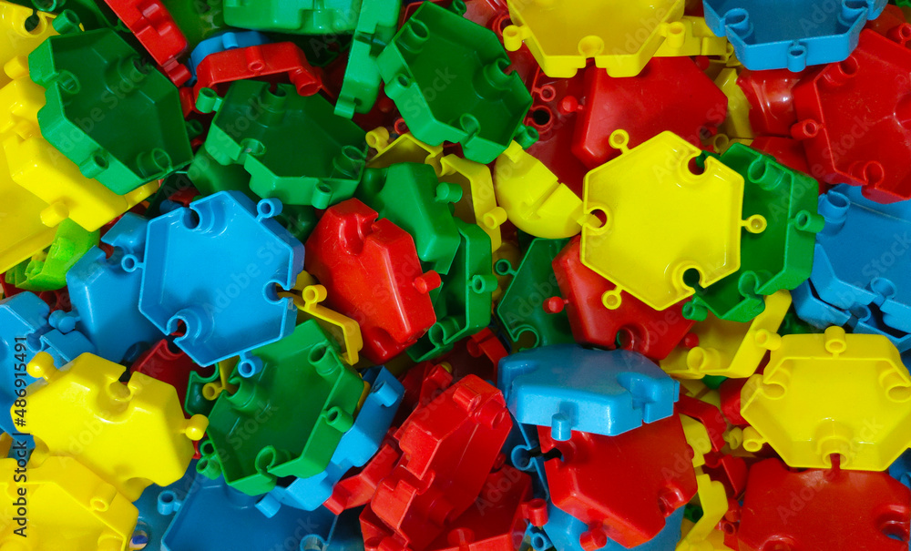 plastic multi colored parts of the children's puzzle constructor close up 