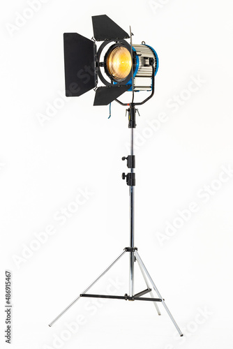 Obraz na plátne Professional film warm lighting, stage light with barndoors on a stand isolated