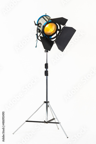 Professional film warm lighting, stage light with barndoors on a stand isolated on a white background photo