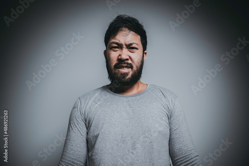 Asian handsome man angry on white background,Portrait of young Stress male concept