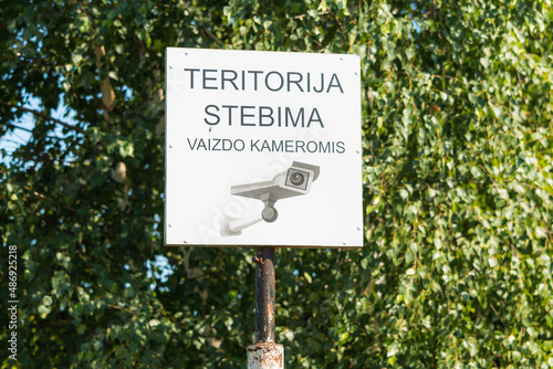 sign area monitored by cameras. teritorija stebima vaizdo kameromis - the area is monitored by video cameras photo