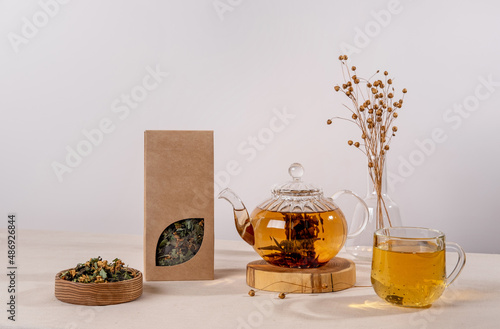 Organic tea branding and packaging mockup. Blank tea packaging mockup with tea. Kraft paper pack with window and empty space to display your branding design.