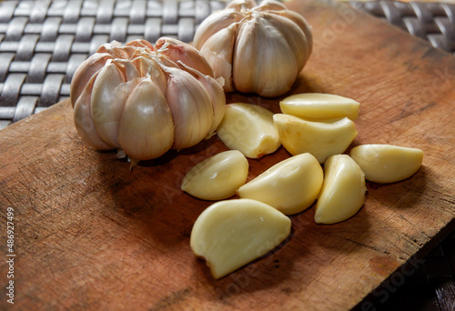 garlic. garlic cloves. peel the garlic clove. Garlic is one of the main spices in Indonesian cuisine