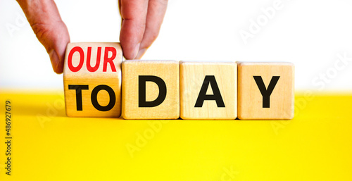 Today is our day symbol. Businessman turns the wooden cube and changes concept words Today to our day. Beautiful white background, copy space. Business, motivation today is our day concept.