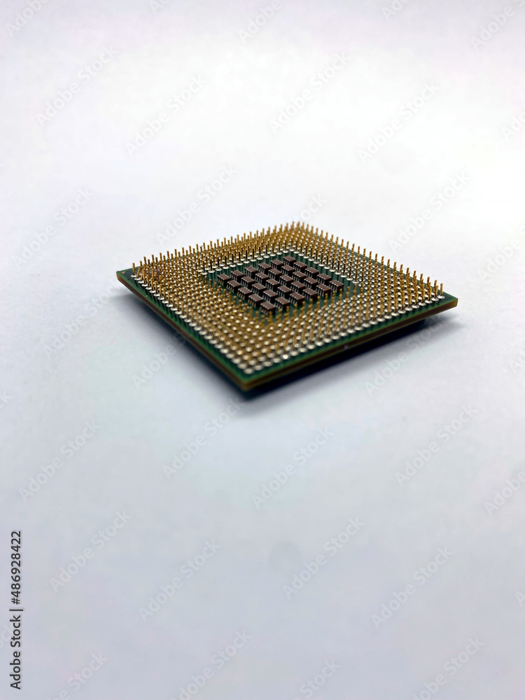 Single microprocessor with pins up closeup view isolated on white Single microprocessor with pins up closeup view isolated on white