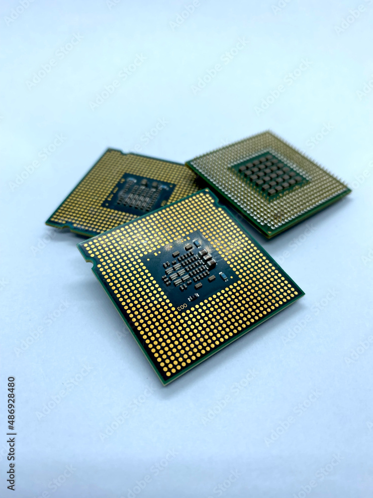 Three micro processors stack closeup view isolated on white Three micro processors stack closeup view isolated on white