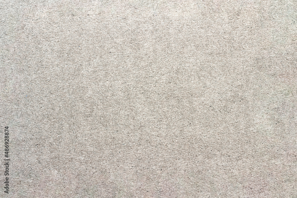 Fototapeta premium Paper texture with small spots and scratches.