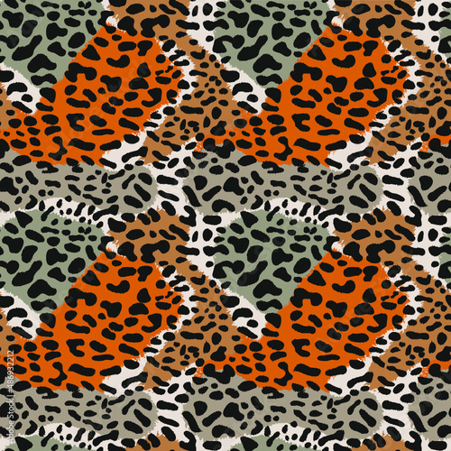 Leopard skin. Seamless pattern with leopard skin. Black spots on a background of brown and gray spots.