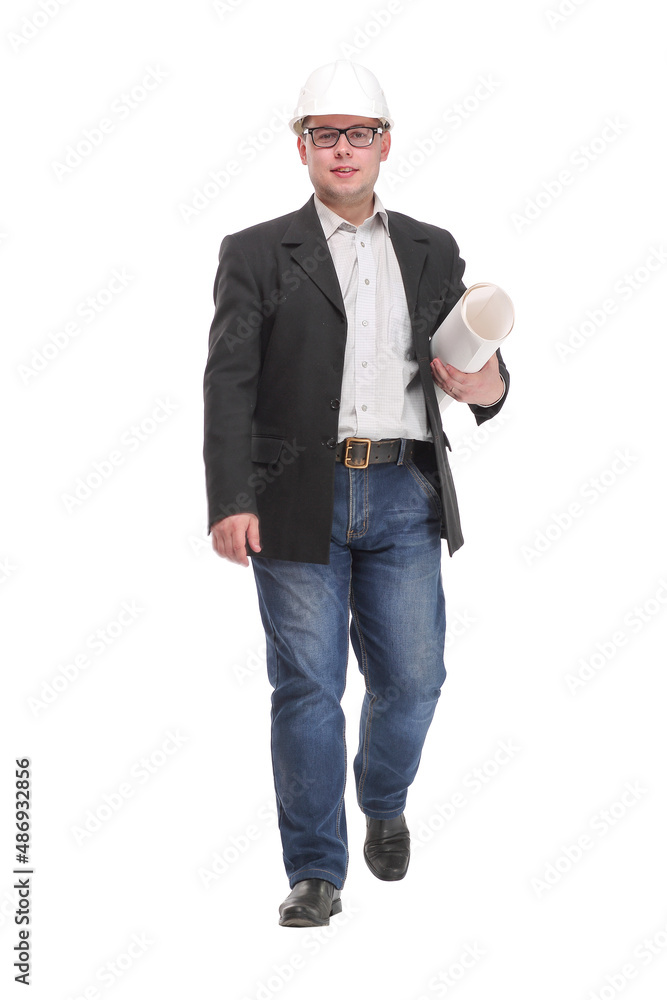 Happy male architect looking away while walking with rolled up blueprint Happy male architect looking away while walking with rolled up blueprint