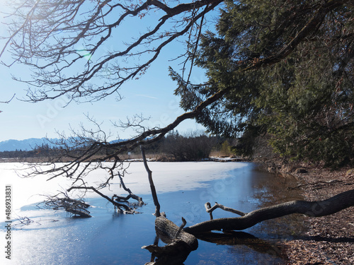Kirchsee, zugefrorener See im tiefen Winter. Schöner und mystischer Moorsee bei Sachsenkam und Bad-Tolz in Oberbayern photo