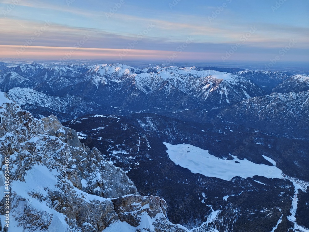 Obraz premium Aerial view on a frozen mountain lake in the alps. View from the top of germany.