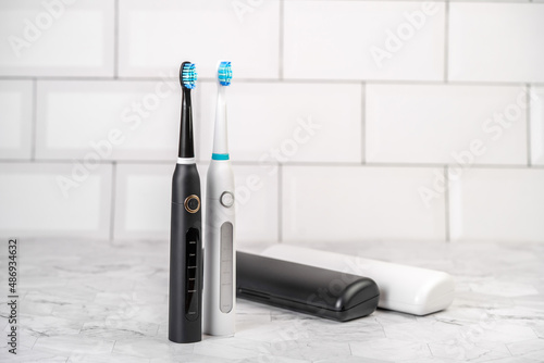 Modern electric toothbrush in a bathroom. Professional dental care.