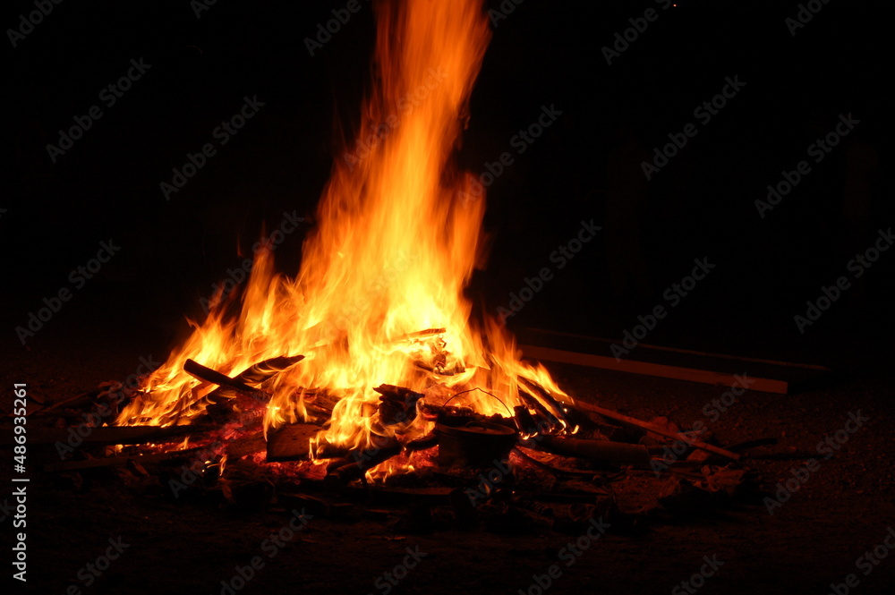 Bonfire with burning boards, large, at night in the dark. For Lag Omer Bonfire with burning boards, large, at night in the dark. For Lag Omer