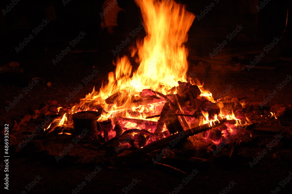 Bonfire with burning boards, large, at night in the dark. For Lag Omer Bonfire with burning boards, large, at night in the dark. For Lag Omer