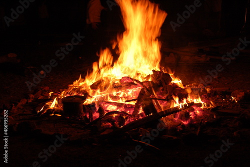 Bonfire with burning boards, large, at night in the dark. For Lag Omer