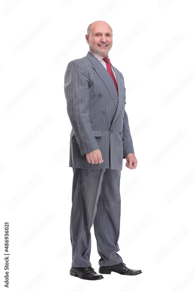 Full length profile portrait of businessman in suit looking at camera Full length profile portrait of businessman in suit looking at camera