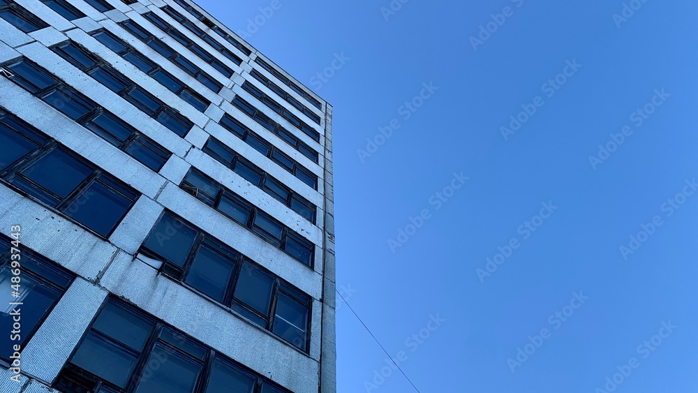 High-rise abandoned office building belonging to an old factory High-rise abandoned office building belonging to an old factory