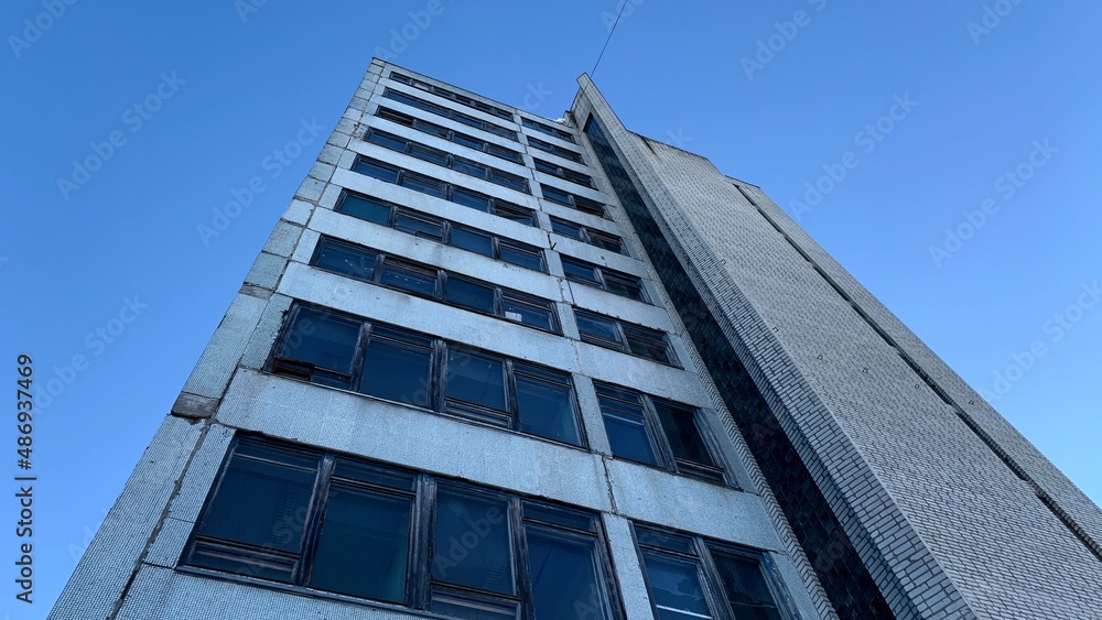High-rise abandoned office building belonging to an old factory High-rise abandoned office building belonging to an old factory