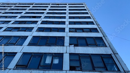 Fotografie High-rise abandoned office building belonging to an old factory