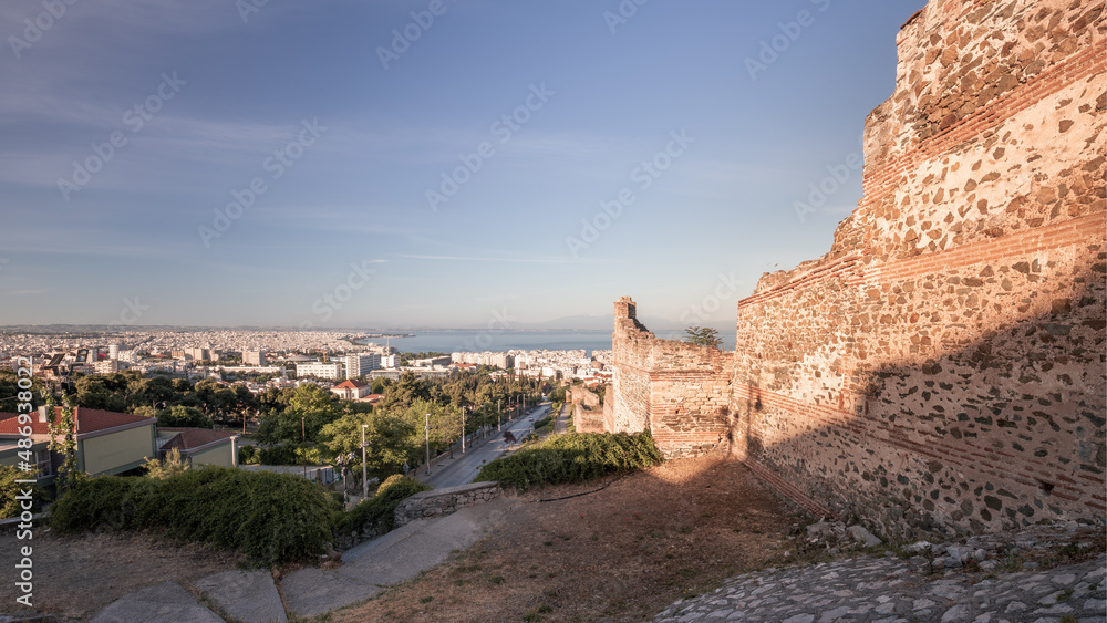 Cityscape with old Byzantine wall ruins, a downtown and living neighborhoods, Thessaloniki, Greece