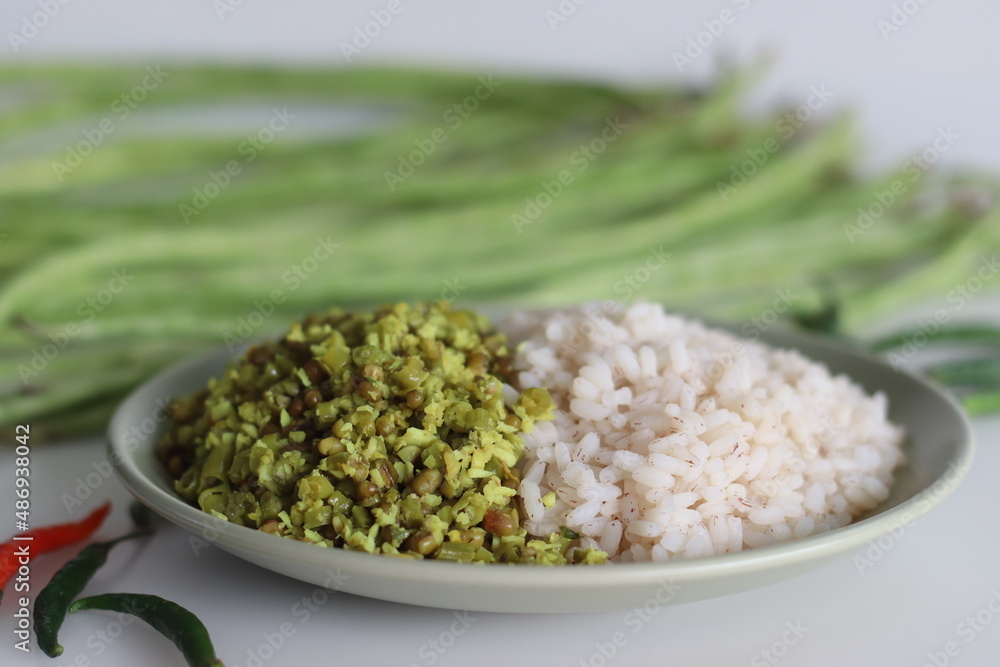 Long beans and boiled mung thoran. A vegetarian side dish of kerala meals served along with boiled brown rice. Long beans and boiled mung thoran. A vegetarian side dish of kerala meals served along with boiled brown rice.