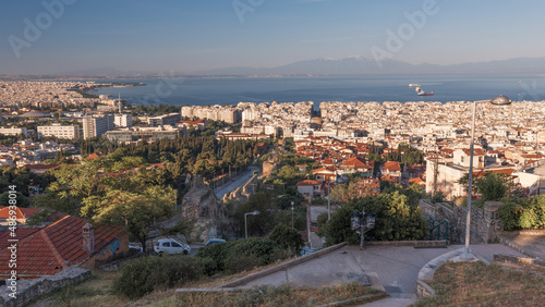 Cityscape with downtown, living neighborhoods, sea and mountains in a haze, Thessaloniki, Greece