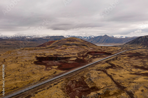 Red ground with mountains and road