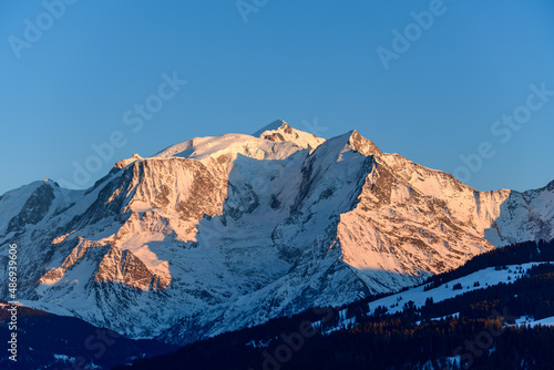 The Mont Blanc massif and its fir forests in Europe, in France, Rhone Alpes, in Savoie, in the Alps, in winter. © Florent