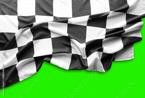 Checkered racing flag on green