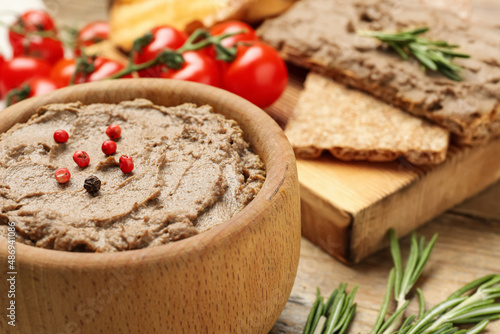 Tasty liver pate with pepper on table, closeup